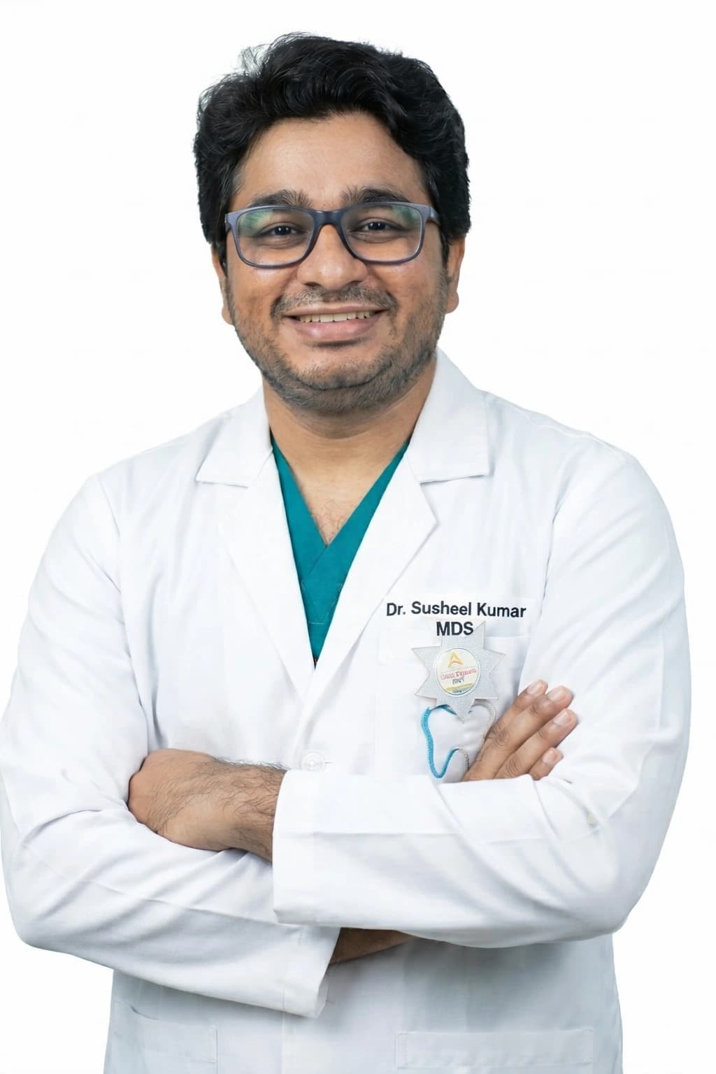 Dr. Susheel smiling in his dental clinic